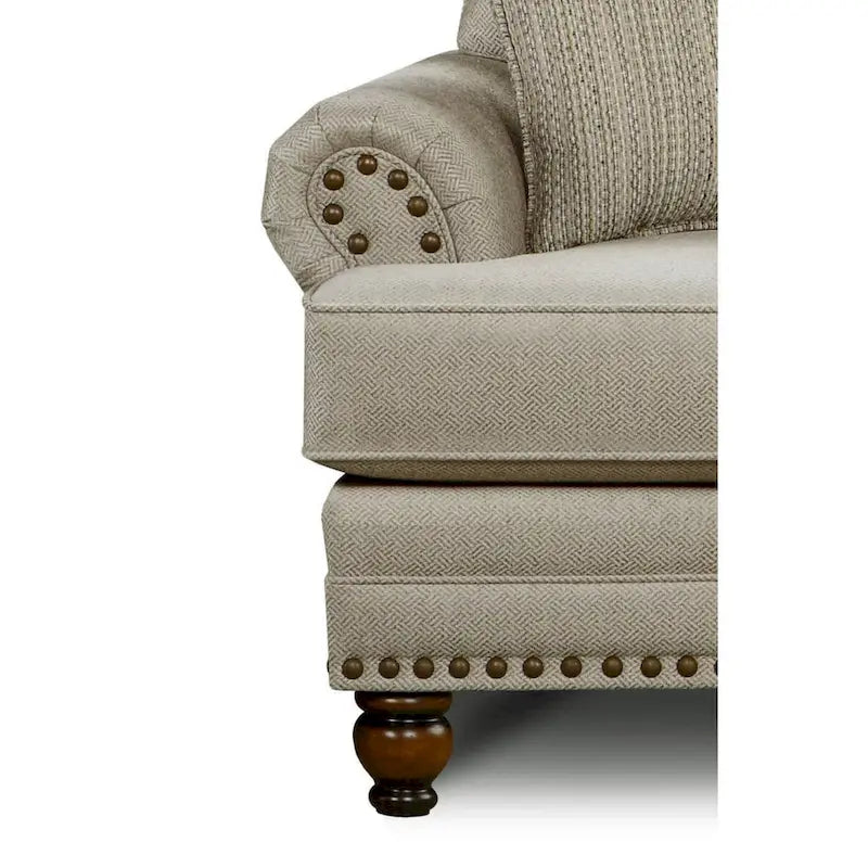 Causeuse de transition beige avec garniture cloutée